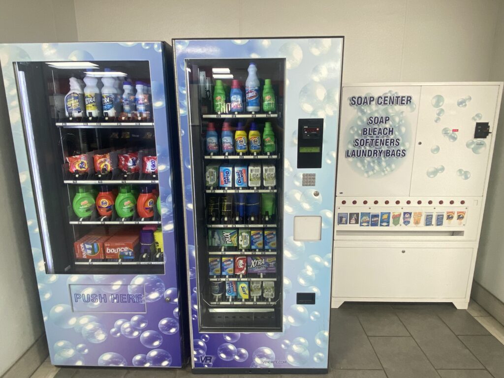Soap center vending machines with laundry supplies